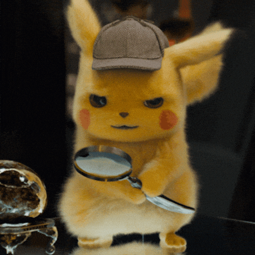 Detective Pikachu looking through a magnifying glass